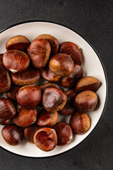 Edible chestnuts delicious treat tasty snack fresh gourmet food background on table rustic food top view copy space