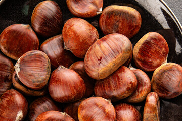 Edible chestnuts delicious treat tasty snack fresh gourmet food background on table rustic food top view copy space