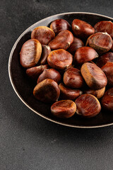 Edible chestnuts delicious treat tasty snack fresh gourmet food background on table rustic food top view copy space