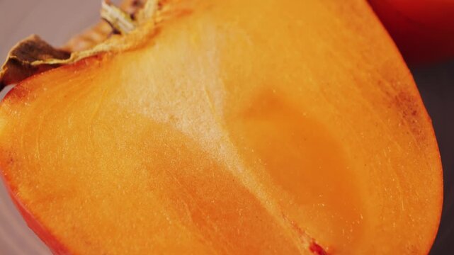 Juicy fresh sweet persimmon. Source of antioxidants and vitamins.