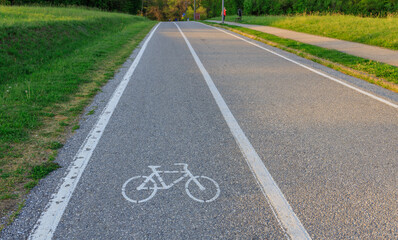 Bike lane is shown on a road with a white line