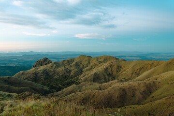 Wide View of Sunlit Rolling Hills and Dry Grass Landscape in Cerro Pelado