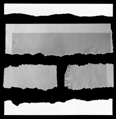 Torn papers on black