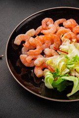 Shrimp salad seafood appetizer tasty snack fresh gourmet food background on table rustic food top view copy space pescetarian diet