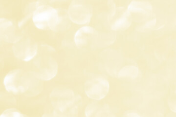 Golden yellow beige cream and white light glitter bokeh texture background. New Year, Christmas and all celebration background concepts.