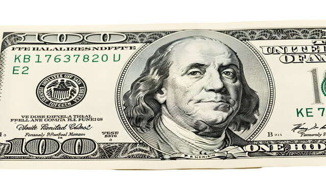 Extreme close up of Benjamin Franklin's portrait on a crisp United States one hundred dollar bill currency detail