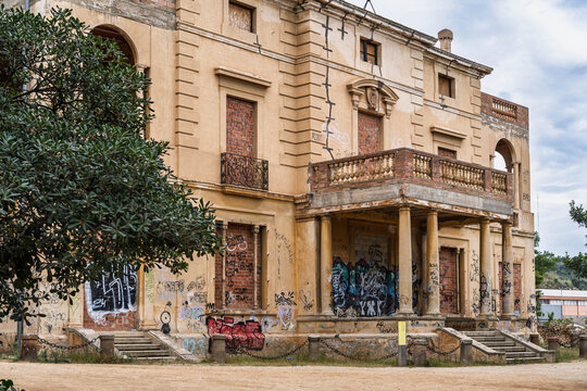 The abandoned neoclassical Torre Arnus mansion covered in graffiti in Can Solei i Ca l'Arnus park. Badalona, Spain