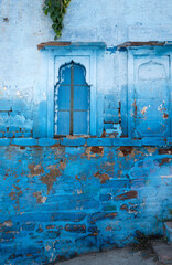 Old rusty metal door in the blue city, Jodhpur