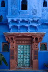 Blue painted wall. Jodhpur door in the blue city