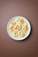 Pasta in a creamy sauce with shrimp and cheese. Seafood. Italian cuisine.