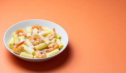 Pasta in a creamy sauce with shrimp and cheese. Seafood. Italian cuisine.