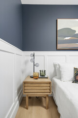 Bedroom with a white wall and a blue wall