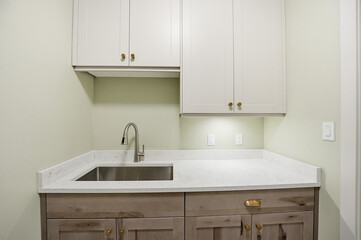Small kitchen with a sink and cabinets