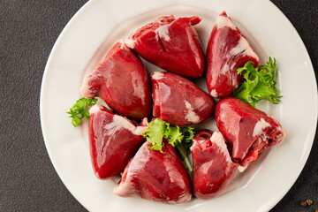 Turkey heart offal meat tasty snack fresh delicious gourmet food background on the table  rustic food top view copy space