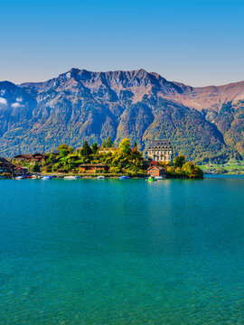 Vertical view of Seeburg Castle on Lake Brienz in autumn