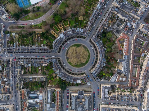 Aerial view of the Circus, a ring of Georgian townhouses creating a harmonious blend of stone and greenery, with a central green space, Bath, England, United Kingdom.