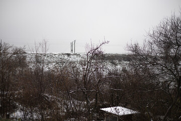 Winter landscape with snow-covered trees and railway
