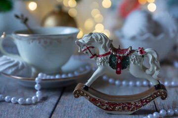 On the table there is New Year's tea 2026, coffee, gingerbread and pine cone cookies.