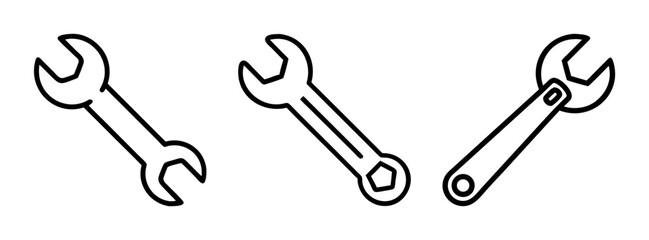 Three wrenches in a row with open ends facing different directions
