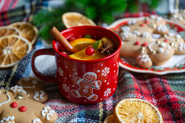 On the table there is New Year's tea 2026, coffee, gingerbread and pine cone cookies.