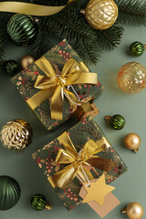 Christmas Gifts with Ornaments and Evergreen Branches on Festive Background
