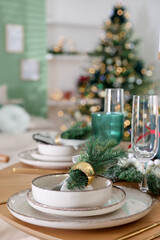 Festive table setting with Christmas decor indoors, closeup