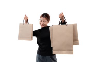 Happy young woman holding shopping bags on transparent background.