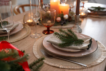Festive table setting with Christmas decor indoors, closeup