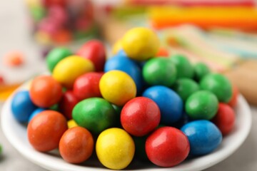 Delicious colorful candies on light table, closeup