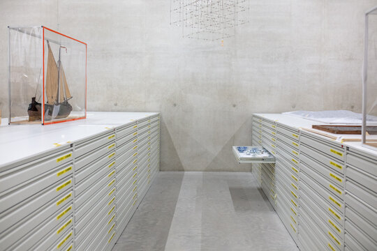 Cabinets with drawers filled with ancient artefacts owned by a historical museum.