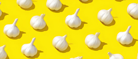 Seamless pattern of fresh garlic bulbs on bright yellow background
