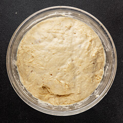 Raw dough yeast starter tasty snack fresh delicious gourmet food table background rustic food top view copy space