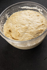 Raw dough yeast starter tasty snack fresh delicious gourmet food table background rustic food top view copy space