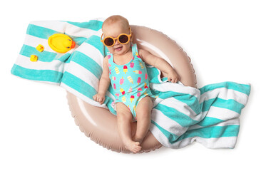 Happy little baby with toy ducks and towel on inflatable ring against white background, top view