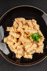 Carbonara pasta fusilli creamy sauce main course Italian cuisine tasty snack fresh delicious gourmet food background on table rustic food top view copy space