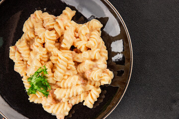 Carbonara pasta fusilli creamy sauce main course Italian cuisine tasty snack fresh delicious gourmet food background on table rustic food top view copy space