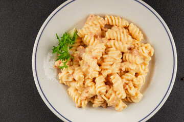 Carbonara pasta fusilli creamy sauce main course Italian cuisine tasty snack fresh delicious gourmet food background on table rustic food top view copy space