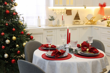 Festive table setting with Christmas decor in kitchen. Interior design