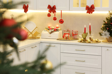 Christmas decor and sweets on countertop in kitchen. Interior design