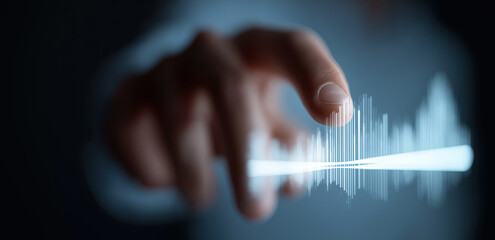 Hand interacts with glowing waveform visualization on futuristic holographic digital interface display.