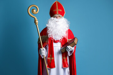 Saint Nicholas with book and crozier on blue background