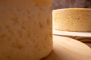 Semi-cured cheese, a wonderful semi-cured cheese from Minas Gerais on a rustic surface, selective focus.