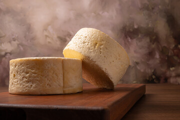 Semi-cured cheese, a wonderful semi-cured cheese from Minas Gerais on a rustic surface, selective focus.