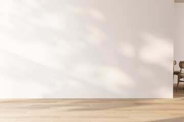 Fototapeta premium Minimalist empty room featuring a large white wall and light wood floor with natural shadows. Clean copy space for advertising and mock-ups. 3d Rendering