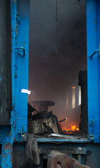 Reportage photo of a burning train car on the rails