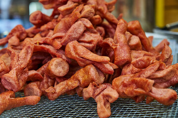 Crispy fried churros at street food stand salchicha