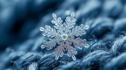 A macro photograph of a delicate snowflake crystal resting on soft blue fabric, revealing intricate icy patterns, symbolizing winter, purity, cold, uniqueness, beauty of nature, and frozen details.
