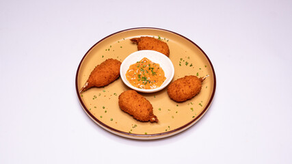 Crispy crab croquettes served on a plate, golden-brown and freshly fried, perfect for seafood menus, restaurant promotions and food photography.