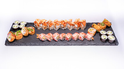 High-quality photo of an assorted sushi set. Photographed on a clean white background, ideal for use in restaurant menus, food blogs, Japanese cuisine promotions and advertising.