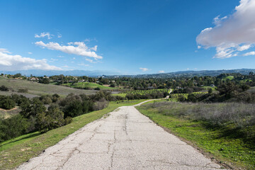 Naklejka premium Old ranch road leading to the San Fernando Valley in Los Angeles, California. Photograph taken at the Upper Las Virgenes Open Space Preserve. 